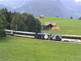 The Panoramic Express Swiss tourist train passes us as we approach Schönried
